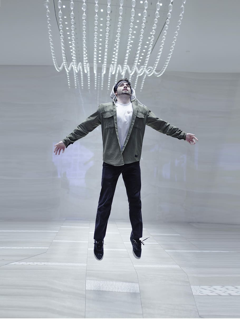 man jumping midair, man jumping inside well lit room, amle, lights HD wallpaper