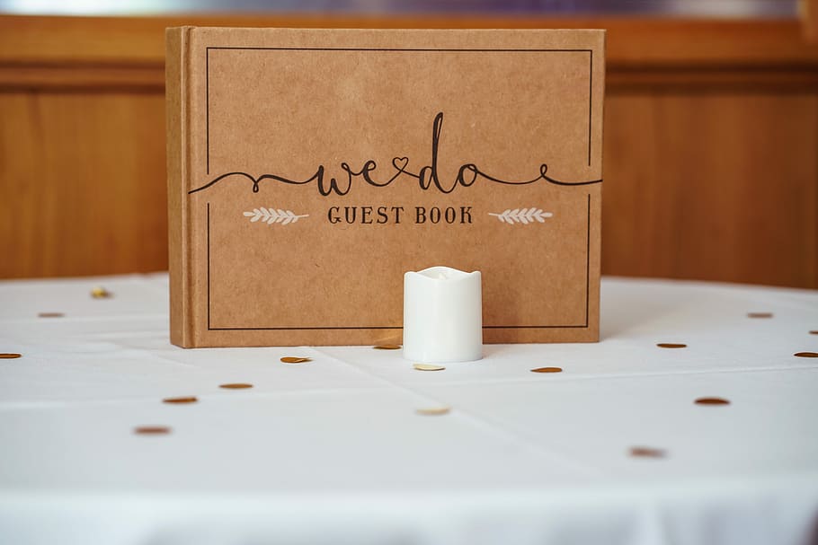 brown Weedo guestbook on table, white votive candle, sign, bokeh HD wallpaper