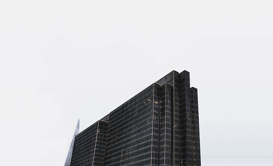 bird's eye views of building under cloudy sky, low-angle photography of high-rise building under clear sky HD wallpaper