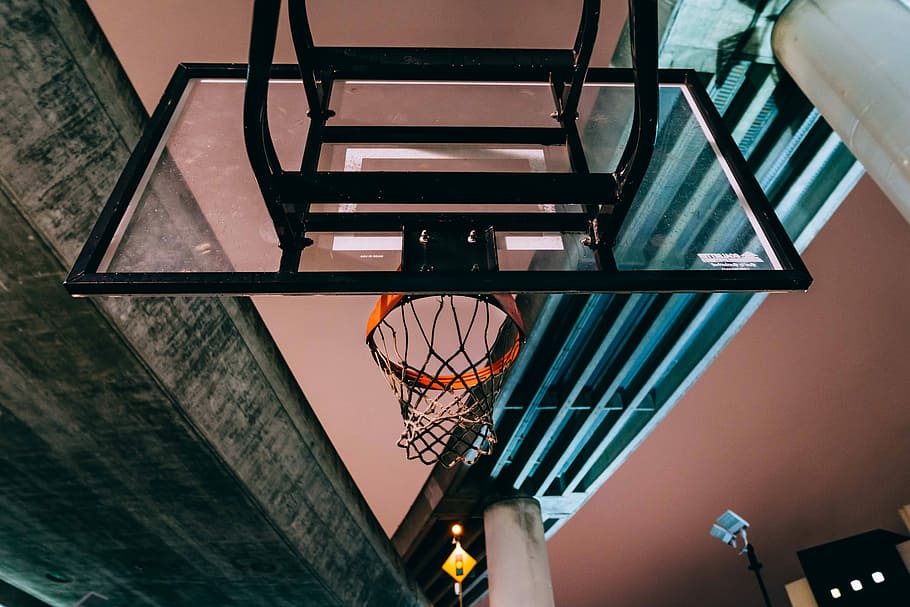 outdoor basketball hoop under gray concrete bridge, low angle photography of baskbetall hoop HD wallpaper