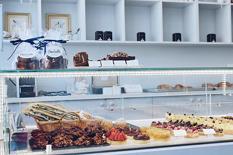 assorted-flavor of sweets inside glass serve over counter, clear glass food display counter HD wallpaper