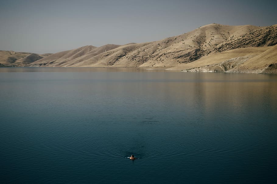 Swimmer in Dukan Dam, person swimming in blue water, lake, mountain range HD wallpaper