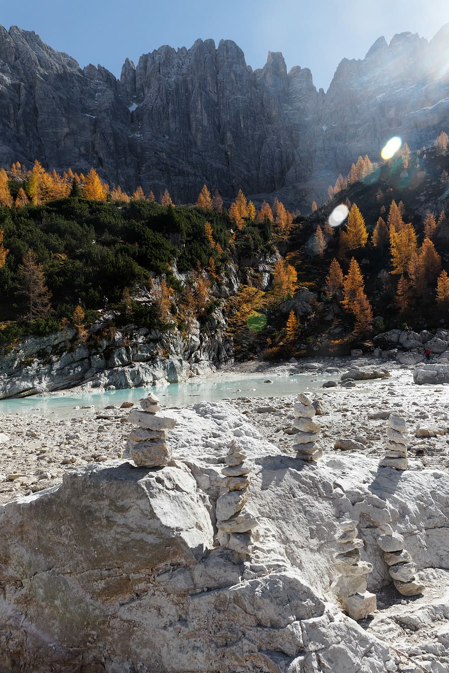 gray balancing stones, stone cairns on rock formation near body of water HD wallpaper