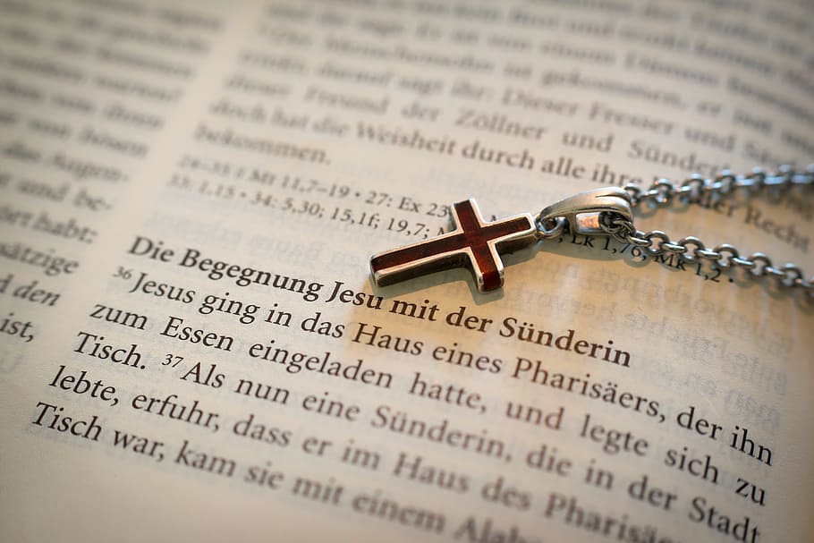 silver-colored cross pendant necklace, bible, redemption, liberation