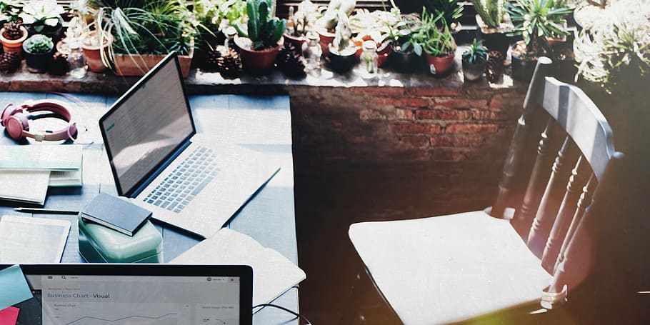 MacBook on gray wooden table near chair, laptop, apple, keyboard HD wallpaper