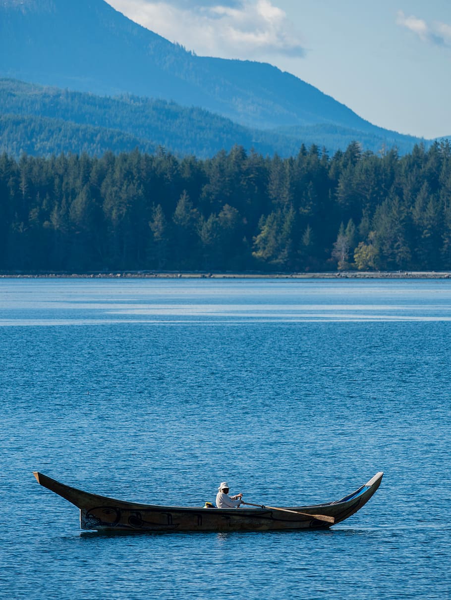 person rowing canoe, person in boat near body of water, mountain HD wallpaper