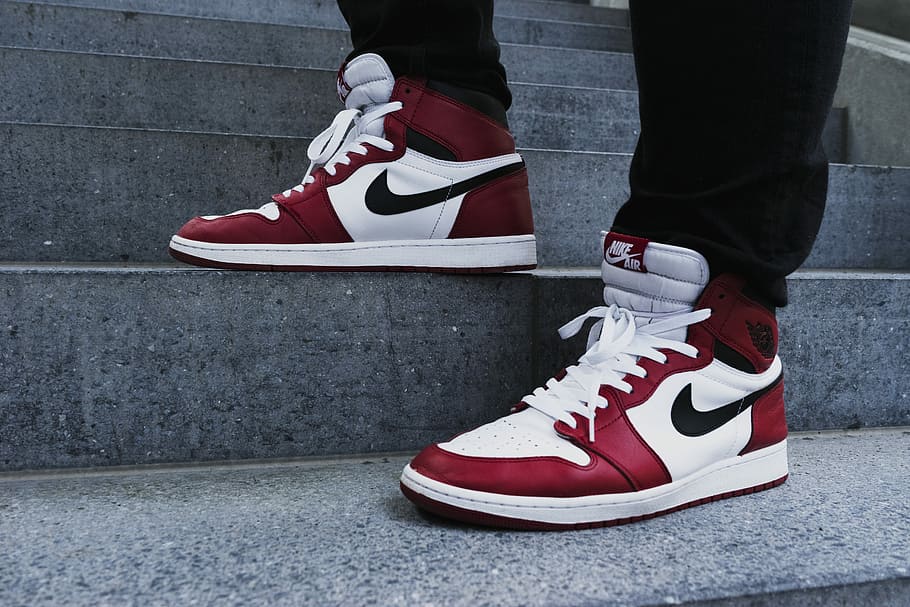 person wearing pair of red-and-white Air Jordan 1 shoes, person in black pants with white-and-red Air Jordan 1 basketball shoes, HD wallpaper