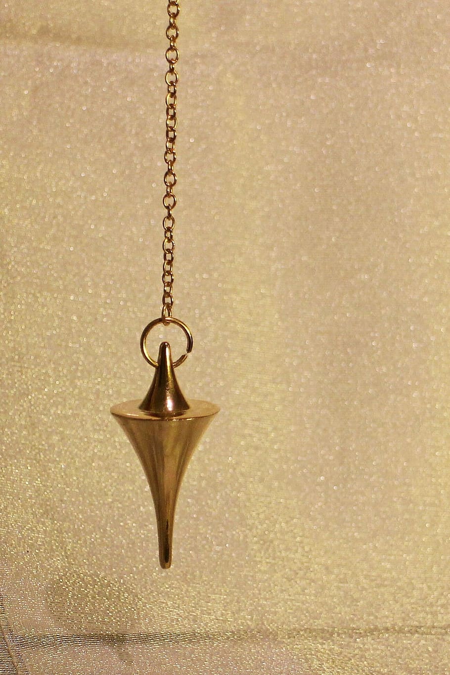 gold-colored pendulum, commute, lot, cone, conical, metal, metal piece HD wallpaper