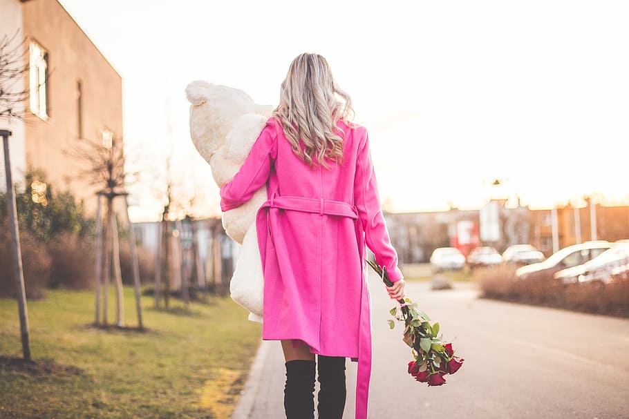 Woman with Big Teddy and Roses Walking on the Street, beauty