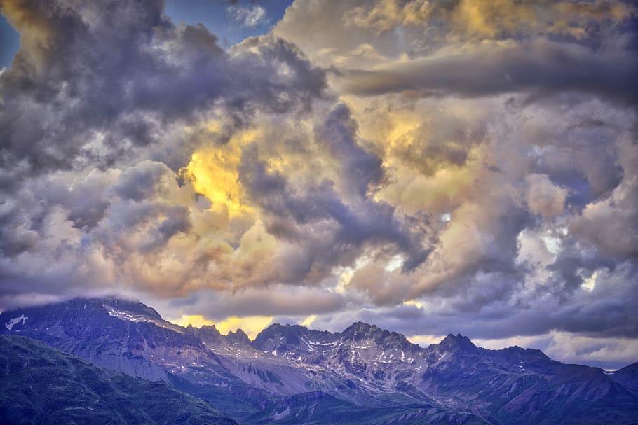 photo of mountain range under golden sky, mountains under nimbus cloud during daytime HD wallpaper
