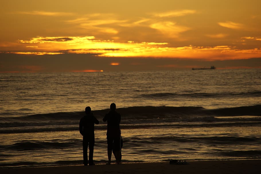 human, beach, sun, sunset, wave, clouds, light, water, sky HD wallpaper