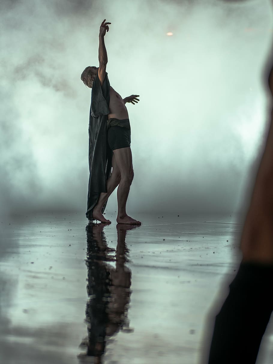man raising his arm, water, reflection, people, dancing, rain HD wallpaper