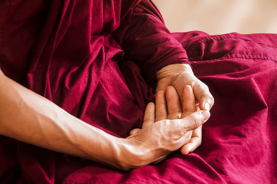 man wearing red clothes, meditation, theravada buddhism, meditating hand posture