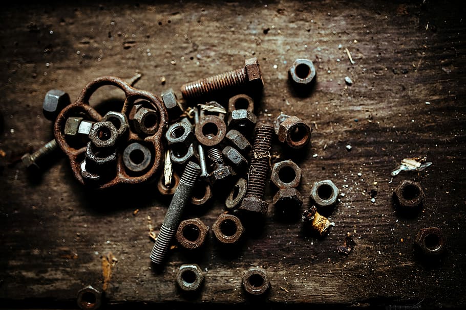 Tools, nails and bolts in a workshop, wooden, metal, nuts, diy