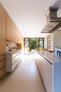 white wooden kitchen island and cupboard cabinets near glass panel door, beige wooden kitchen cabinet inside room HD wallpaper