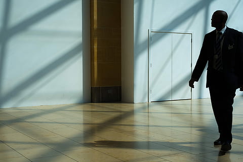 man walking on hallway, man walking on pathway, building, interior HD wallpaper