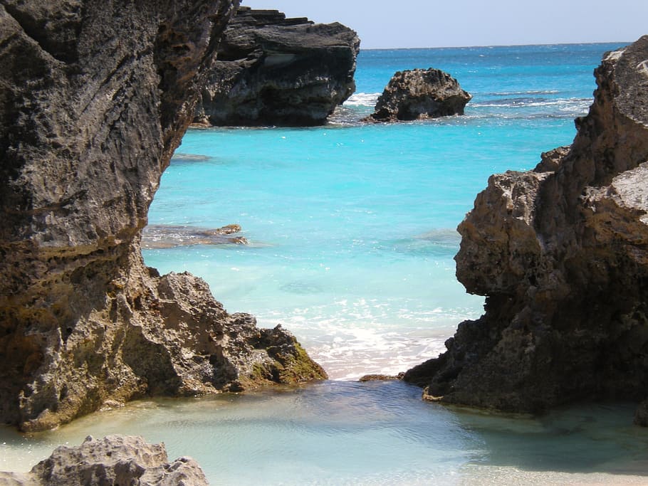 photo of rock cliffs surrounding body of water, bermuda, ocean HD wallpaper