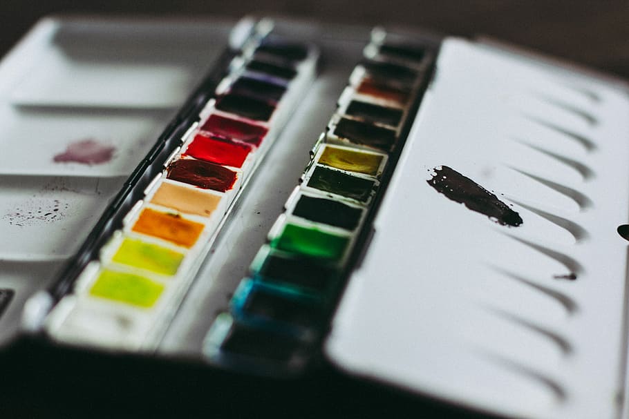 closeup photo of paint palette, water color, colors, depth, mood