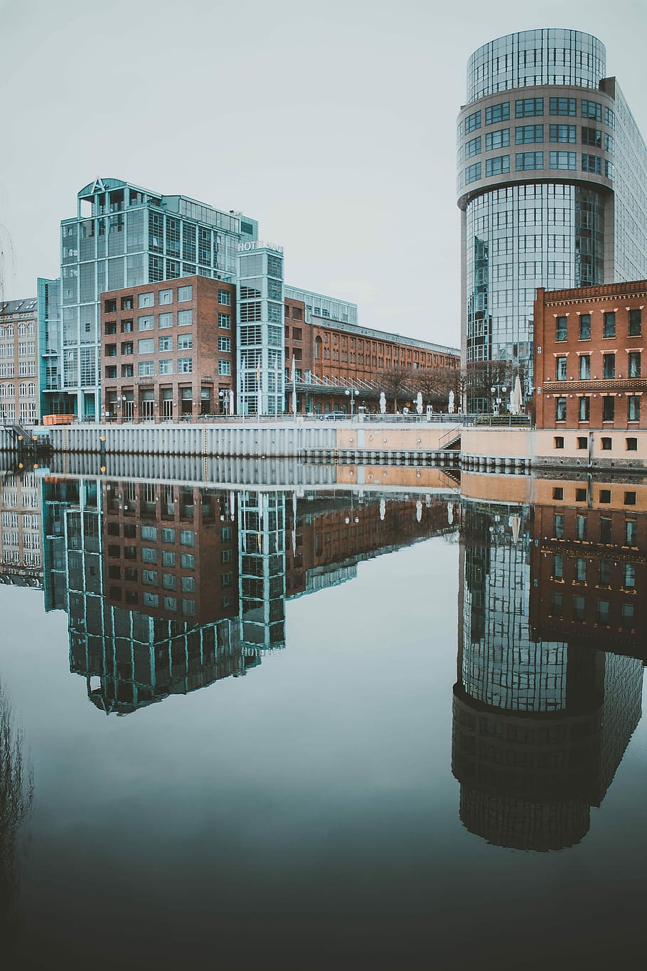 Early Bird, photo of high-rise buildings reflecting on calm body of water HD wallpaper