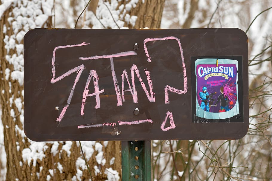 black CapriSun case, closeup photo of Satan? signage, graffiti HD wallpaper