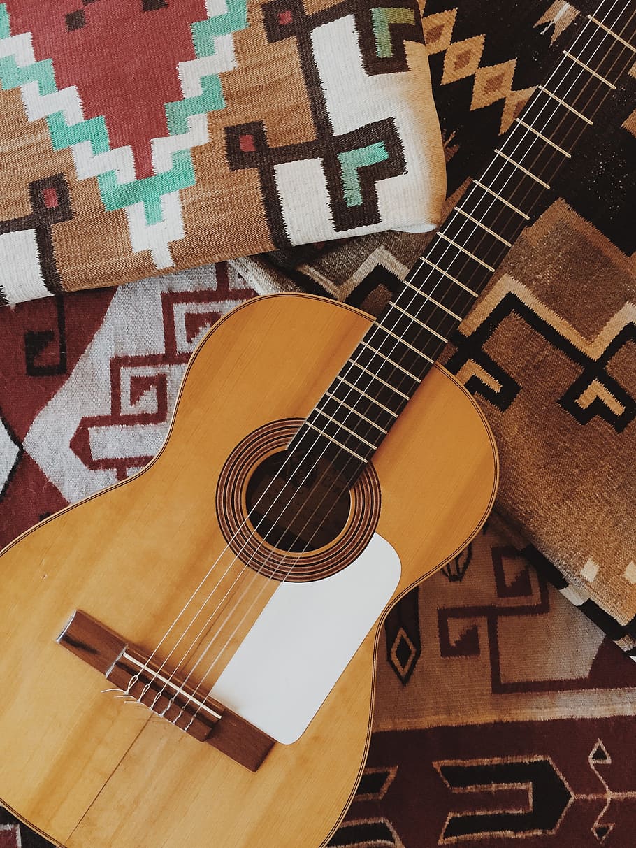 brown acoustic guitar on brown textile, person taking photo of brown acoustic guitar HD wallpaper