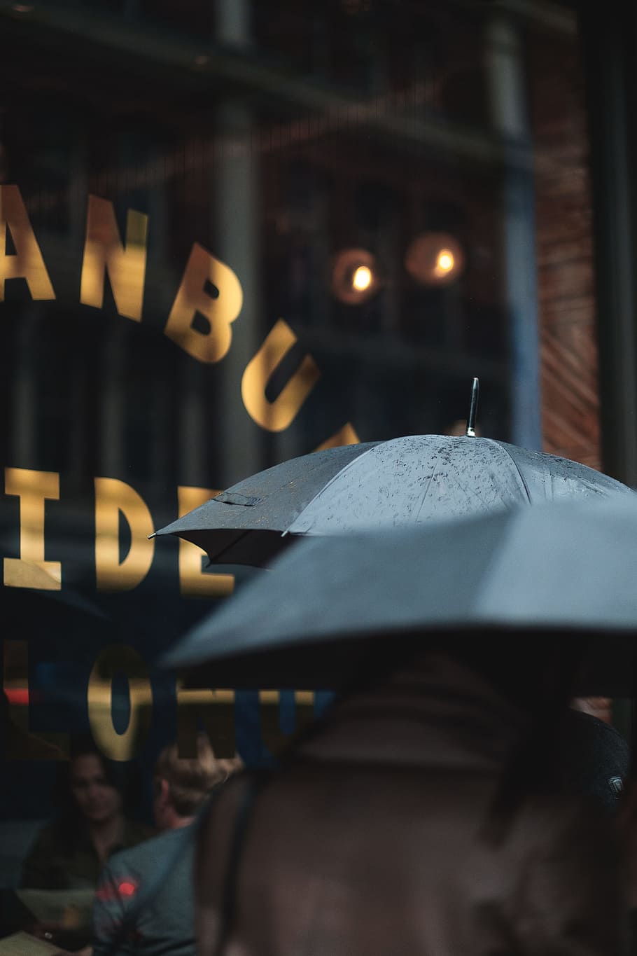 man on blue umbrella, macro photography of people walking on street holding umbrella during rainy day HD wallpaper