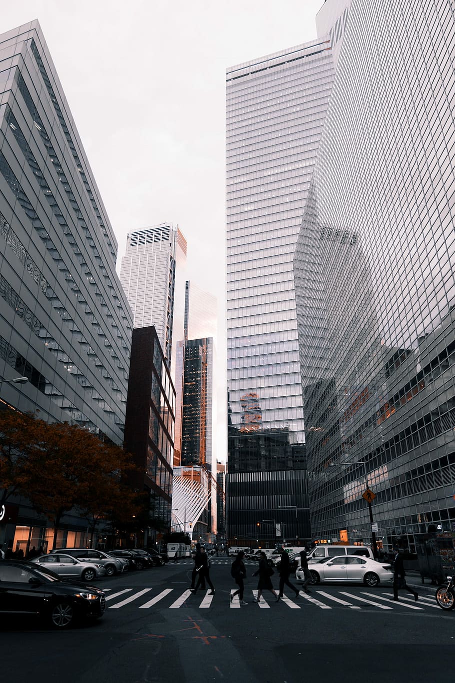 group of people walking on pedestrian lane between high-rise buildings, silver sedan HD wallpaper
