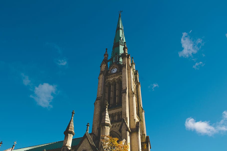 low-angle photography of cathedral under calm blue sky, view HD wallpaper