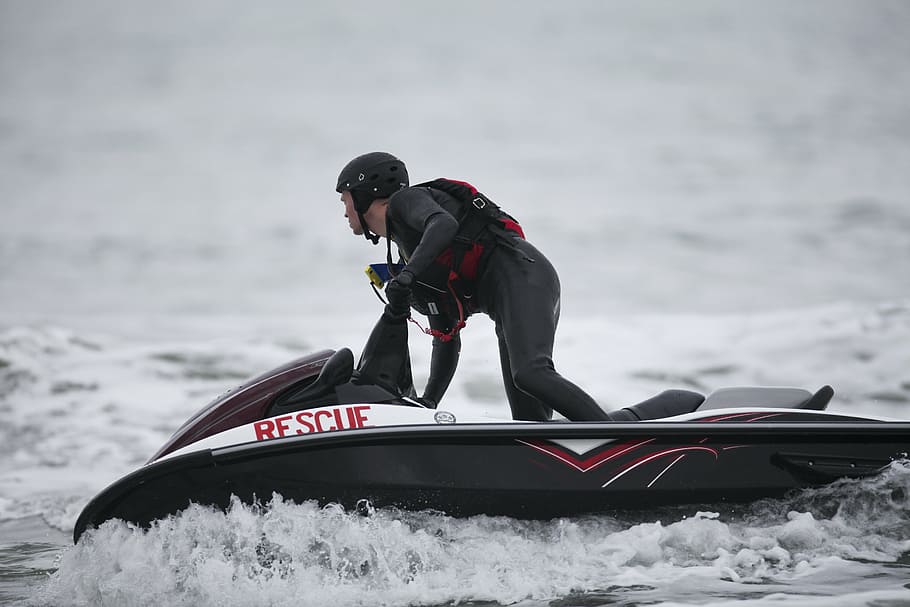 man riding personal watercraft on sea, jetski, rescue, training HD wallpaper