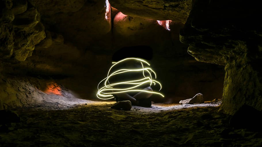 Cave Light, timelapse photography of person inside cave during daytime HD wallpaper