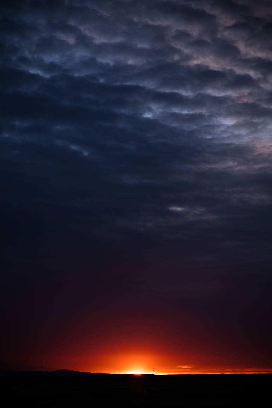 silhouette of mountain at golden hour, orange sunset with dark clouds HD wallpaper