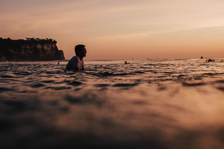 person swimming on sea during daytime, man in body of water, ocean HD wallpaper