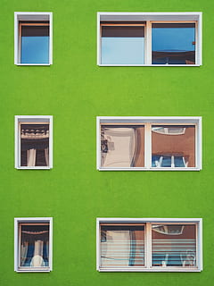 architectural photography of green house with windows, green concrete building with white frame window HD wallpaper