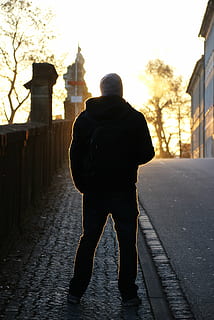 Stylish black man walking along street on sunny day - a Royalty Free Stock  Photo from Photocase