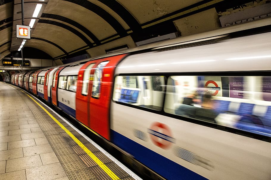 A tube train arrives at a platform on the London Underground, HD wallpaper
