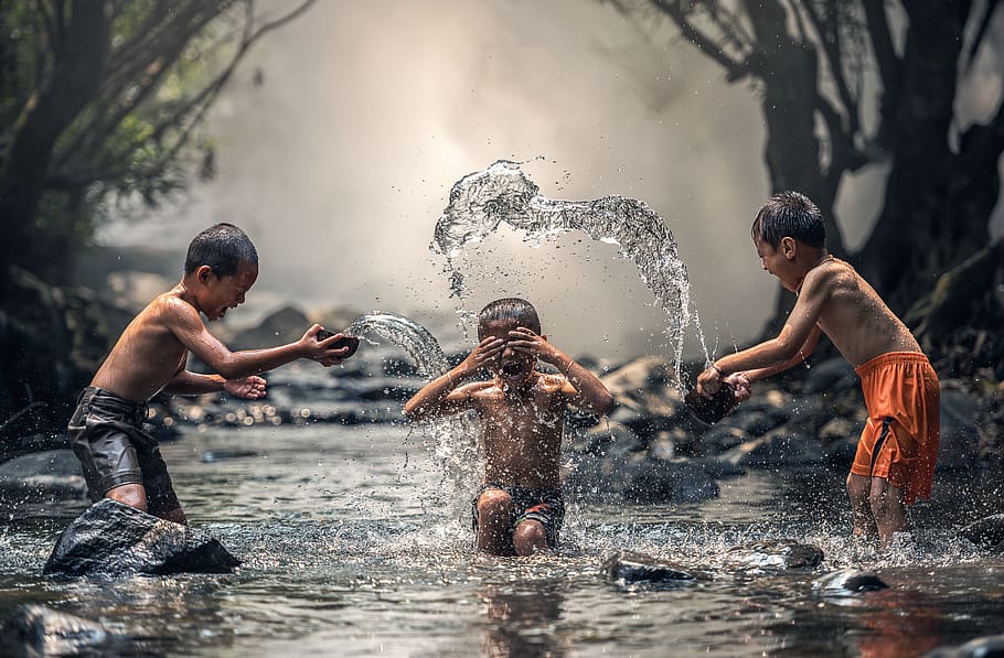 children playing on body of water, as children, river, enjoy