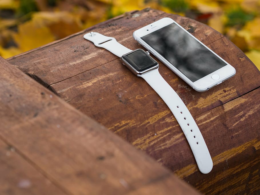 silver aluminum case Apple Watch with white Sport Band and silver iPhone 6 both on log, HD wallpaper