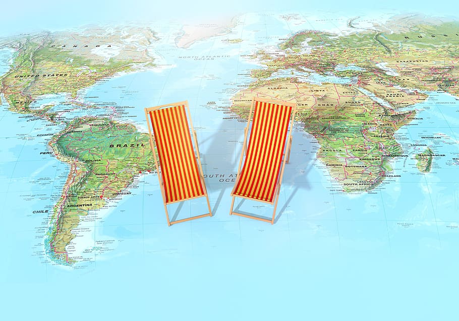 photo of two brown wooden lounge chairs on world map, ocean, 3d render