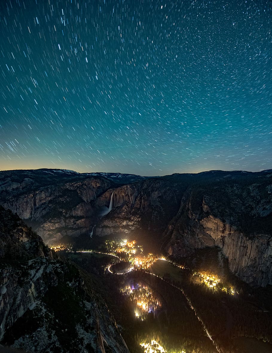 time lapse photography of street light, aerial photo of forest fire during nighttime under starry night HD wallpaper