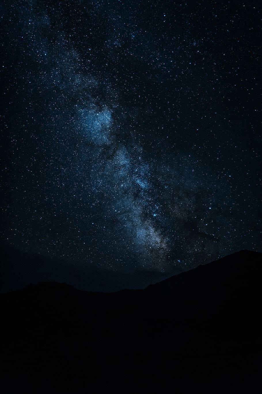 silhouette of mountain under starry night sky, milky way, stars