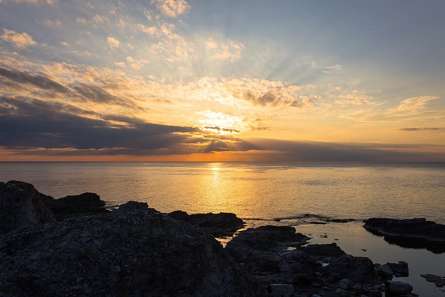 sea, ocean, water, wave, nature, cliff, rock, sky, clouds, sunset HD wallpaper