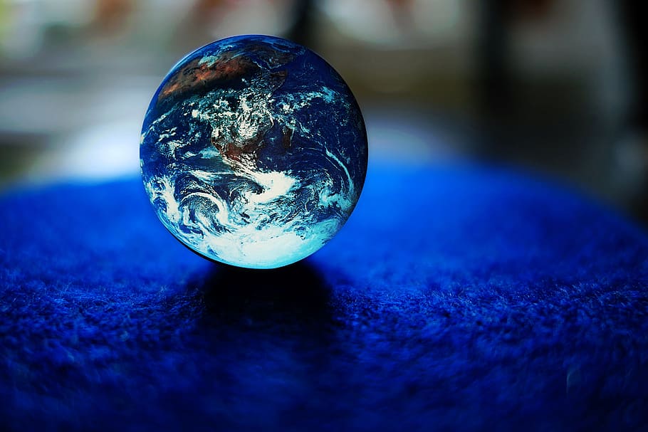 shallow focus photography of blue toy marble, Earth, ball, glass