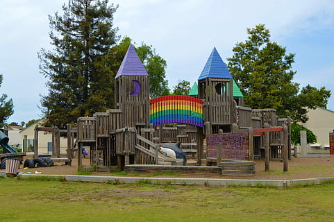 brown wooden playground park under white and blue sky during daytime HD wallpaper