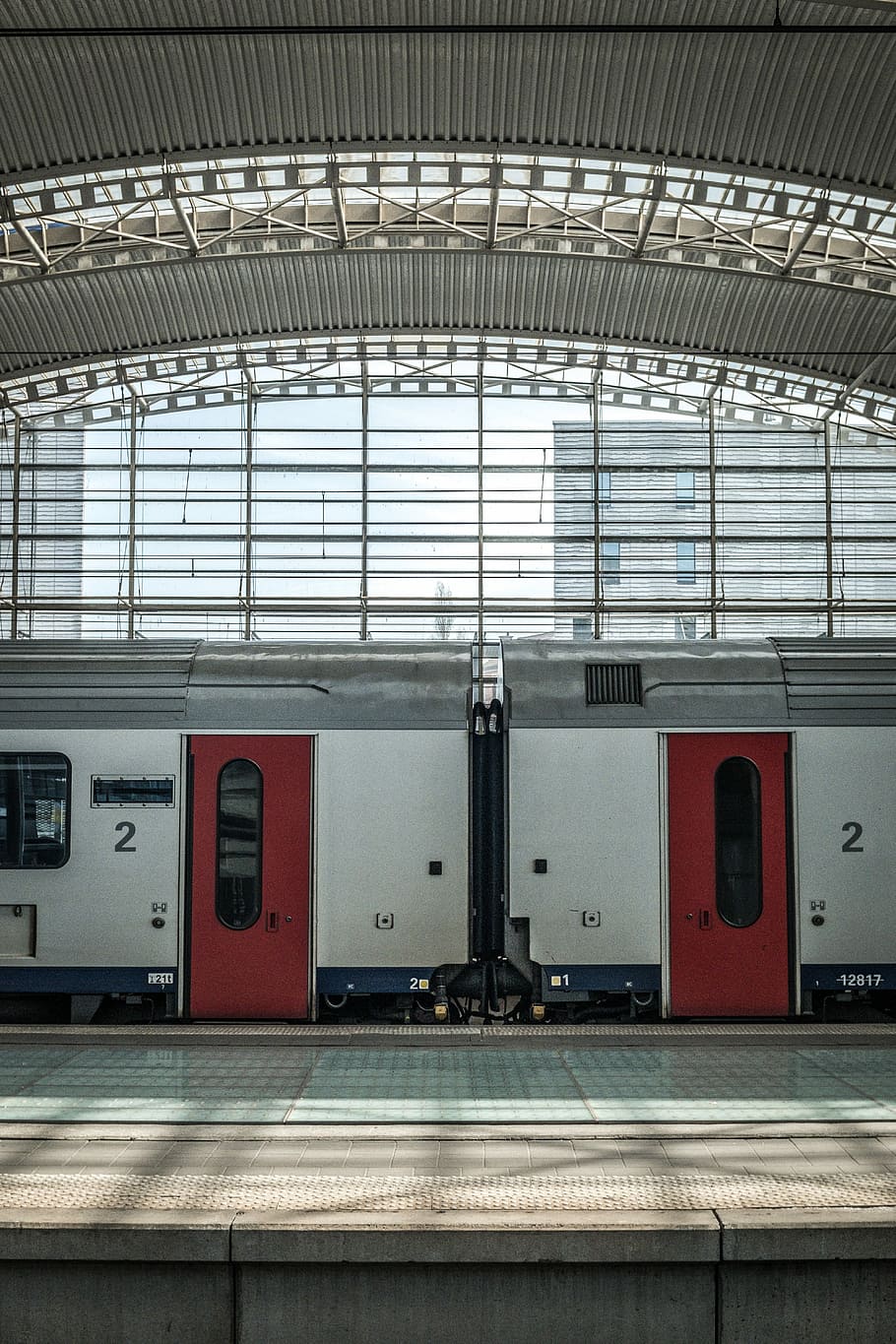 white and red train in train station during daytime, red and white train under dome HD wallpaper