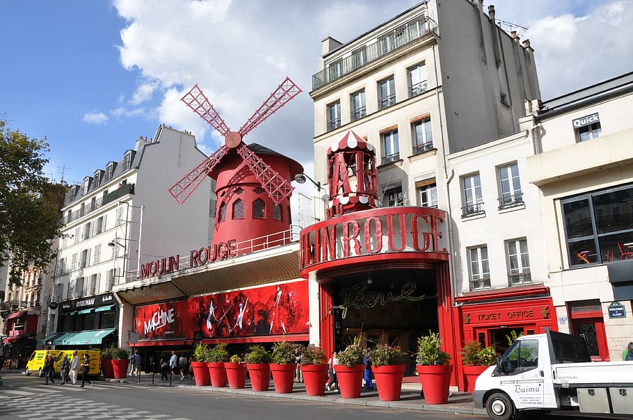 white 3-storey commercial building, paris, mulin rouge, cabaret