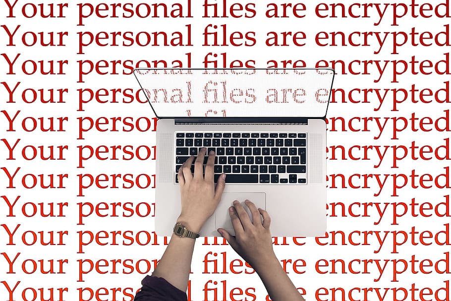 person typing on MacBook, Laptop, Keyboard, Cyber, Attack, wannacry