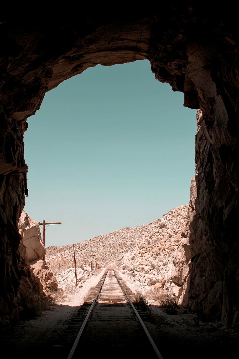 surrounded, train tunnel in deserted land, track, railroad, cave