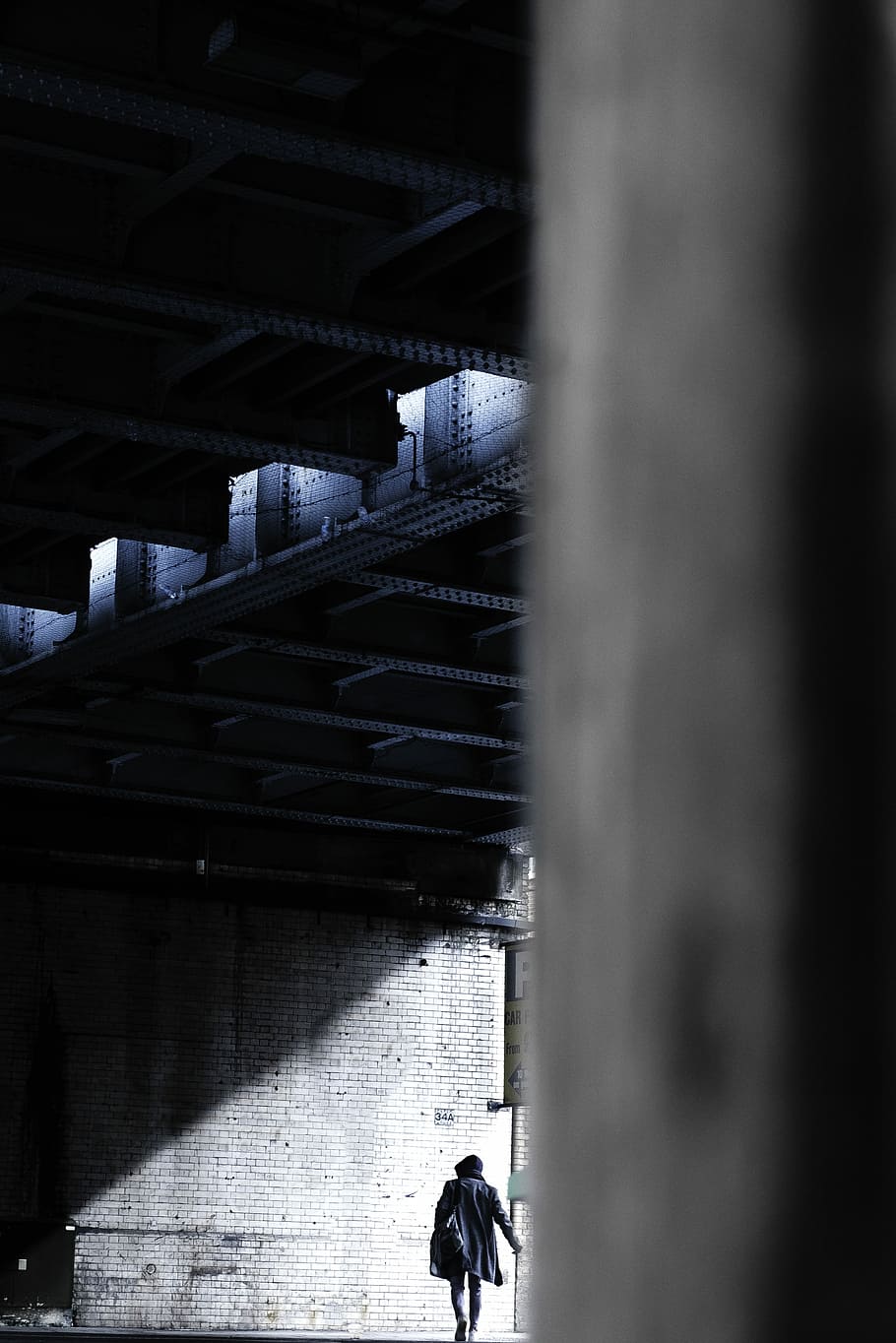 person walking towards street, person walking towards the wall with light shining through HD wallpaper