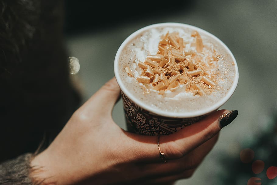person holding disposable cup, person holding white and black cup filled with brown chocolate HD wallpaper
