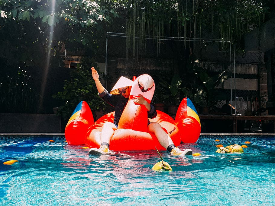 person riding red inflatable bird boat on swimming pool, water HD wallpaper